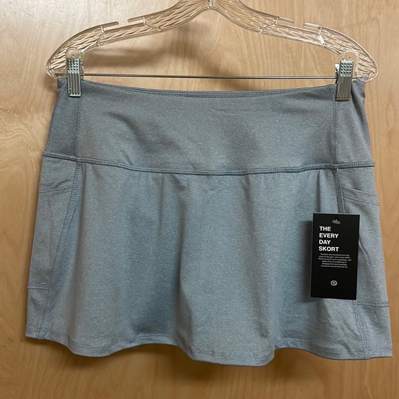 etonic Dresses & Skirts - COPY - NWT Etonic athletic, heathered grey, with a touch of blue skort. Many po…